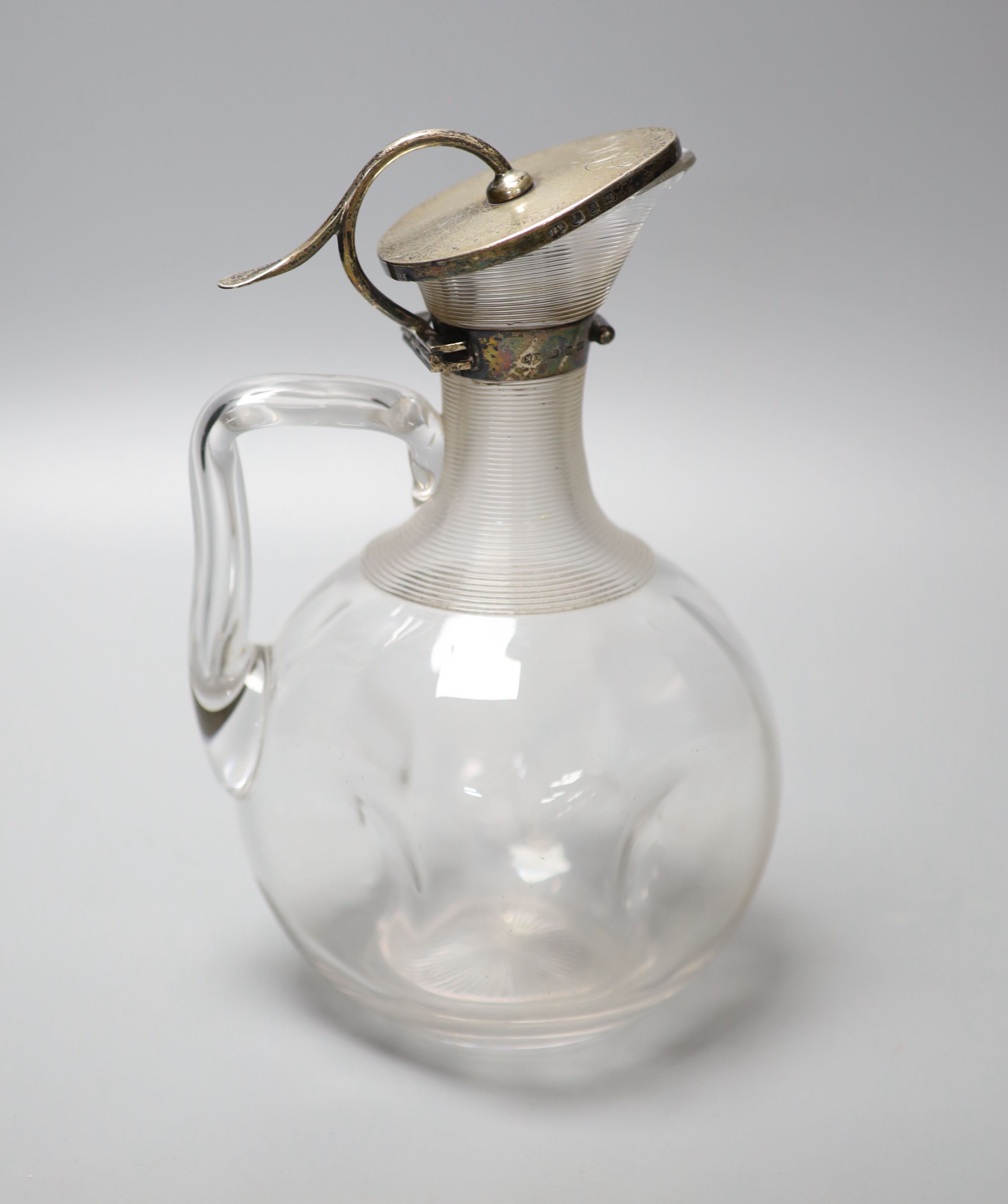 A Victorian silver mounted glass claret jug, with ribbed collar, Norton & White, Birmingham, 1896, 21.2cm.